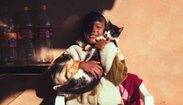 Girl holding cat
