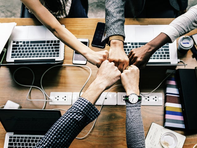 Group putting hands together