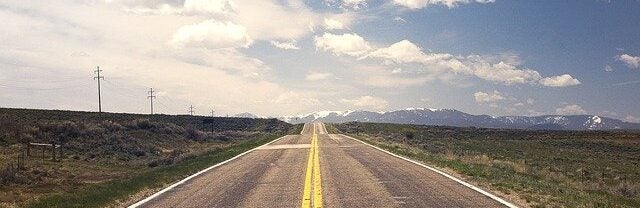 Straight road ahead - blue sky