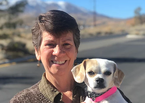 Kelley Bollen, MS, CABC, holds dog