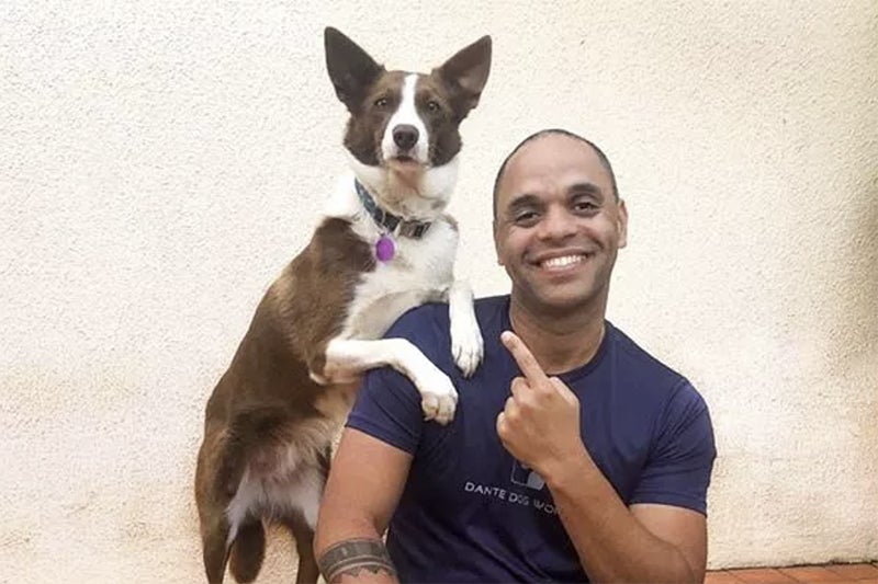 Dante Camacho poses with dog
