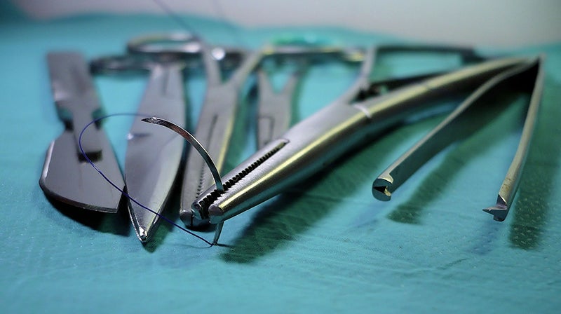 Surgical tools resting on surface