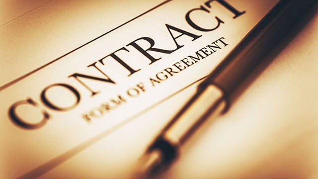 Close up of a document with the words "CONTRACT"
